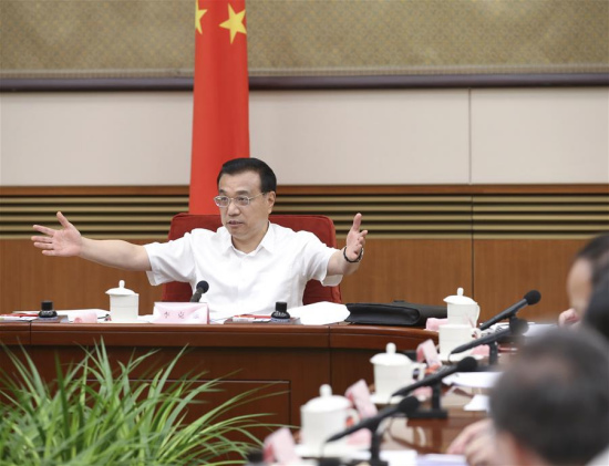 Chinese Premier Li Keqiang presides over a national conference on social investment in Beijing, capital of China, July 18, 2016. Chinese Vice Premier Zhang Gaoli also attended the conference. (Xinhua/Pang Xinglei) 