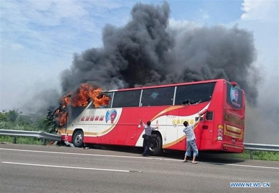 Photo taken on July 19, 2016 shows the accident site of a coach fire in Taipei, southeast China's Taiwan. A tourist coach caught fire on a highway near Taoyuan Airport on Tuesday, killing 26 people on board, including 24 mainland tourists from northeastern Liaoning Province. (Xinhua)