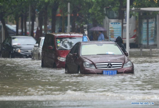 Cars drive on a waterlogged road in Shijiazhuang, capital city of north China's Hebei Province, July 20, 2016. A heavy rain hit the middle and southern areas of Hebei Province in last three days. Precipitation in many cities including Handan, Xingtai and Shijiazhuang reached 630 mm. (Xinhua/Zhu Xudong) 