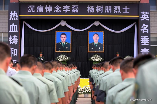 A funeral ceremony is held to bid farewell to deceased Chinese UN peacekeepers Yang Shupeng and Li Lei in Xuchang, central China's Henan Province, July 21, 2016. (Xinhua/Zeng Tao) 