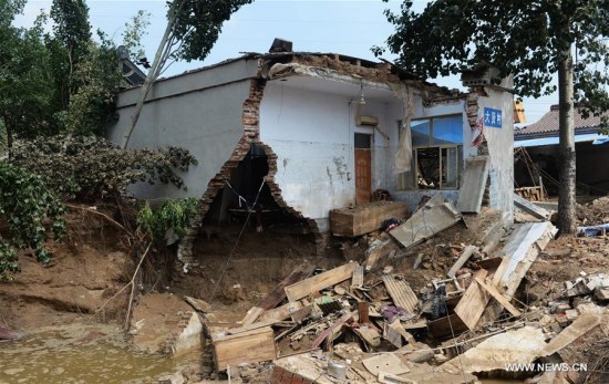 Photo taken on July 24, 2016 shows a house destroyed in floods in Daxian Village of Xingtai City, north China's Hebei Province.  (Xinhua/Wang Xiao) 