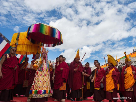 The 11th Panchen Lama Bainqen Erdini Qoigyijabu arrives for the Kalachakra ritual in Xigaze, southwest China's Tibet Autonomous Region, July 24, 2016. (Xinhua/Purbu Zhaxi)
