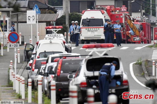 Police officers and rescue workers are seen near a facility for the disabled, where at least 19 people were killed and as many as 20 wounded by a knife-wielding man, in Sagamihara, Kanagawa prefecture, Japan, in this photo taken by Kyodo July 26, 2016. (Photo/Agencies)