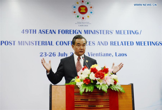 Chinese Foreign Minister Wang Yi attends a press conference after the meeting between Chinese Foreign Minister and the counterparts from 10 ASEAN members in Vientiane, Laos, July 25, 2016. (Xinhua/Liu Ailun)