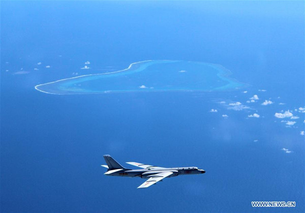 Undated photo shows a Chinese H-6K bomber patrolling islands and reefs including Huangyan Dao in the South China Sea. The People's Liberation Army (PLA) Air Force conducted a combat air patrol in the South China Sea recently, which will become a regular practice in the future, said a military spokesperson on July 18, 2016. (Photo/Xinhua)