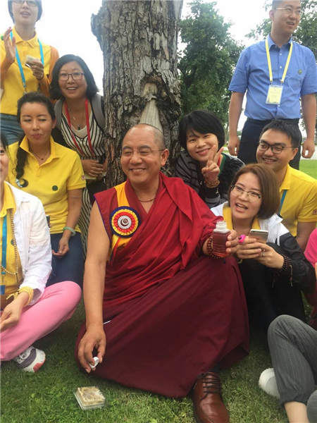 Khenpo Sodargye, a Tibetan Buddhist scholar, attends the Sixth World Youth Buddhist Symposium in Chiang Mai, Thailand. Provided To China Daily