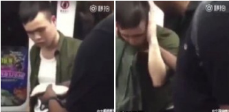 Photo shows that a black man slaps a Chinese man around the head twice while riding the subway.(Photo/Screenshot)