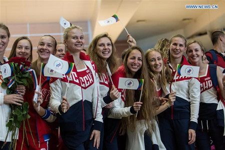 Russian athletes bid farewell to people at the Sheremetyevo airport in Moscow, Russia, July 28, 2016. About 70 Russian athletes left Moscow on Thursday for Rio de Janeiro to take part in the Rio 2016 Olympic Games. Those athletes are from Russian national teams of volleyball, handball, boxing, table tennis, synchronised swimming and equestrian. (Xinhua/Evgeny Sinitsyn)