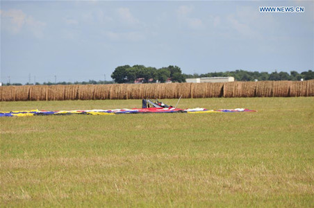 Debris of the balloon is seen at the site of a balloon crash accident near Lockhart, a city in the central part of the U.S. state of Texas, July 30, 2016. U.S. Texas Department of PUBLIC Safety has confirmed that 16 people were killed on Saturday morning after a hot air balloon caught on fire and crashed near Lockhart. The accident occurred shortly after 7:40 a.m. local time on Saturday near Lockhart, when the hot air balloon with at least 16 people on board crashed into a pasture, the Federal Aviation Administration (FAA) said in a statement on Saturday. (Xinhua/Zhang Yongxing)