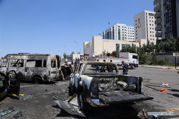 Damaged vehicles are seen outside the presidential palace in Ankara, Turkey, July 16, 2016. Turkey's prime minister said on Saturday that at least 161 people were killed and 1,440 wounded in the coup attempt that swept the country on Friday night but was foiled by Saturday morning. (Xinhua/Zou Le)