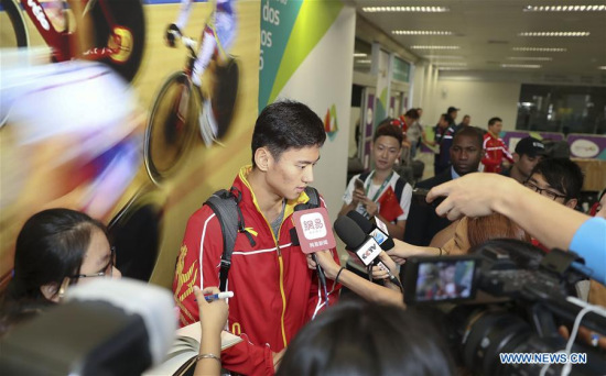 Chinese swimming athlete Ning Zetao receives an interview at the Galeao International Airport in Rio de Janeiro, Brazil, on July 31, 2016. The members of Chinese national swimming team arrived at Rio de Janeiro on Sunday. (Xinhua/Cao Can)
