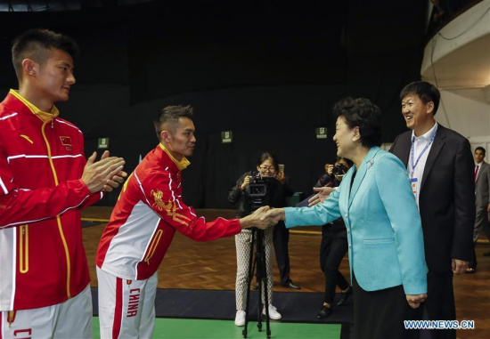 Chinese vice premier Liu Yandong (2nd R) shakes hands with Chinese athlete Lin Dan (2nd L) during her inspection in Sao Paulo, Brazil, Aug. 3, 2016. (Photo/Xinhua)