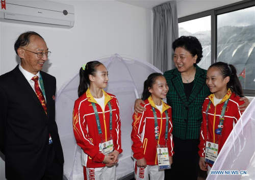 Chinese vice premier Liu Yandong(2nd R), Chinese president Xi Jinping's special envoy, hugs members of Chinese gymnastics team during her visit to Chinese Olympic delegation in Rio de Janeiro, Brazil on Aug. 4, 2016. Liu Yandong visited Chinese Olympic delegation here on Thursday. (Xinhua/Han Yan)