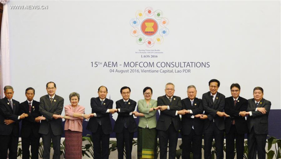 Delegates pose for a group photo during the 15th China-ASEAN (10+1) economic ministers' meeting in Vientiane, Laos, on Aug. 4, 2016. Chinese Minister of Commerce Gao Hucheng attended the meeting. (Xinhua/Liu Ailun)
