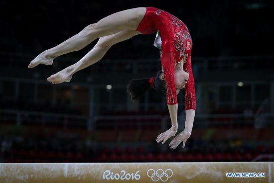 Shang Chunsong of China acts during the competition of Balance Beam of women's artistics gymnastics qualification at the 2016 Olympic Games, in Rio de Janeiro, Brazil, on Aug. 7, 2016. (Xinhua/Zheng Huansong)