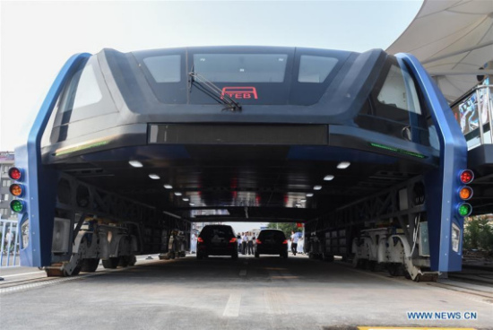 The transit elevated bus TEB-1 is on road test in Qinhuangdao, north China's Hebei Province, Aug. 2, 2016. China's home-made transit elevated bus, TEB-1, conducted a road test running Tuesday. (Xinhua/Luo Xiaoguang)