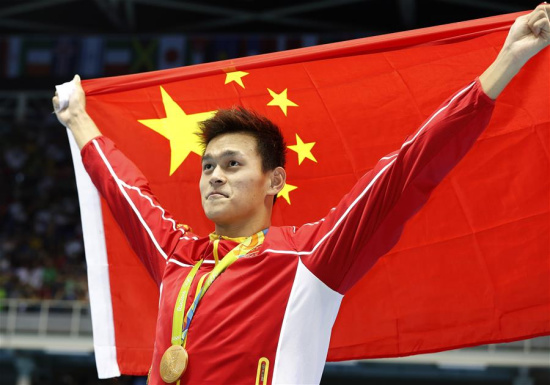 Sun Yang of China celebrates during the awarding ceremony of men's 200m freestyle swimming final at the 2016 Rio Olympic Games in Rio de Janeiro, Brazil, on Aug. 8, 2016. Sun Yang won the gold medal with 1 minute 44.65 seconds.Xinhua/Ding Xu