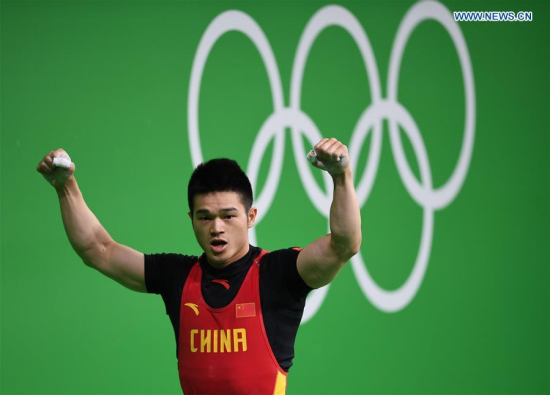 China's Shi Zhiyong celebrates during the men's 69kg final of weightlifting at the 2016 Rio Olympic Games in Rio de Janeiro, Brazil, on Aug. 9, 2016. Shi Zhiyong won the gold medal. (Xinhua/Cheng Min) 