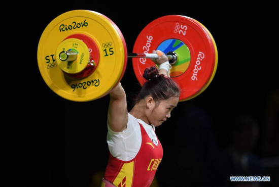 Deng Wei of China competes during the women's 63KG weightlifting group A final at the 2016 Rio Olympic Games in Rio de Janeiro, Brazil, on Aug. 9, 2016. Deng Wei won gold medal with clean and jerk, total world records. (Xinhua/Cheng Min)