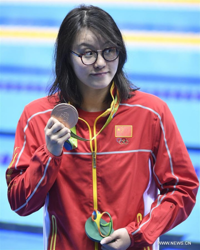 China's Fu Yuanhui attends the awarding ceremony of women's 100m backstroke swimming final at the 2016 Rio Olympic Games in Rio de Janeiro, Brazil, on Aug. 8, 2016. Fu Yuanhui won the bronze medal with 58.76 seconds. (Xinhua/Wang Peng) 