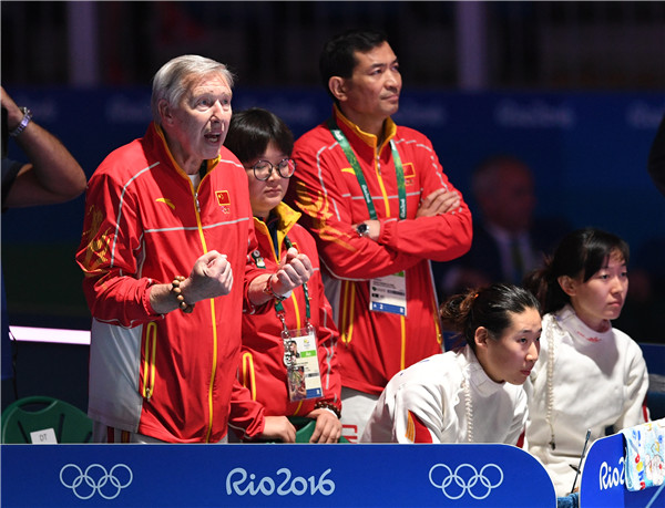 Daniel Levavasseur, head coach of Chinese national epee team, cheer up for his player during the women's epee team final at Carioca Arena 3, Rio de Janeiro, Brazil on August 11, 2016. (Photo by Wei Xiaohao/chinadaily.com.cn)