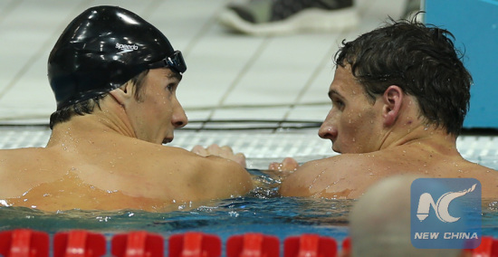 Phelps and Lochte talk after the men's 200m individual medley at London Olympics. (Xinhua)