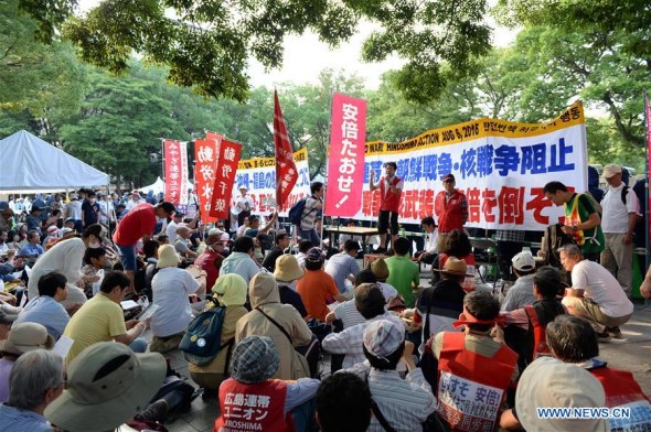 People attend a protest near the Peace Momorial Park in Hiroshima, Japan, on Aug. 6, 2016.  (Xinhua/Ma Ping)