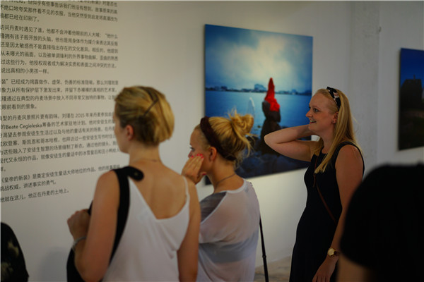 Visitors at the ongoing art shows at the Danish Cultural Center in Beijing's 798 art zone. (Photo provided to China Daily)