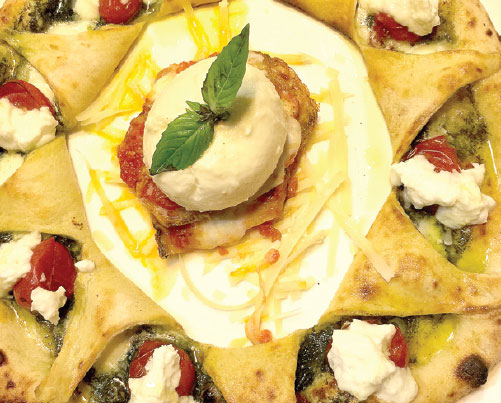 The kitchen team at La Pizza in Shangdu SOHO will substitute lactose-free cheese in any menu item. (Mike Peters / China Daily)