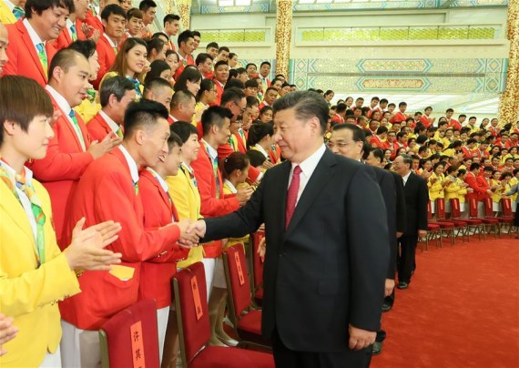 Chinese President Xi Jinping and other senior leaders Li Keqiang, Zhang Dejiang, Yu Zhengsheng, Liu Yunshan, Wang Qishan and Zhang Gaoli meet with Chinese Olympic delegation at the Great Hall of the People in Beijing, capital of China, Aug. 25, 2016. (Photo: Xinhua/Lan Hongguang)