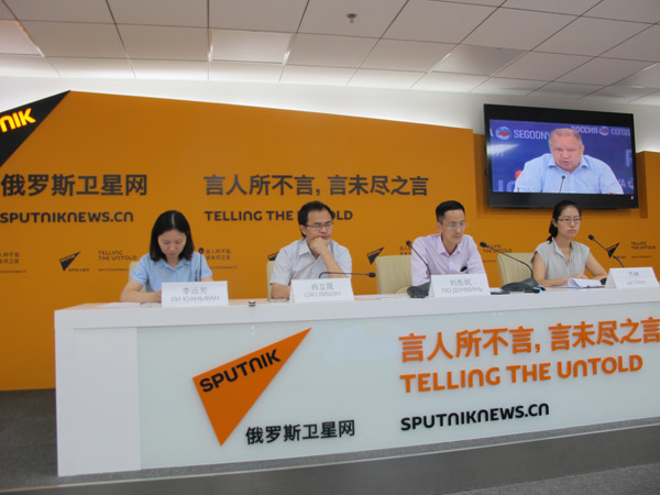 Scholars from Chinese Academy of Social Sciences exchange view with their Russian counterparts in a telephone conversation held between Beijing and Moscow on Aug 25 ahead of the 2016 G20 summit. (Photo by Wang Mengzhen/chinadaily.com.cn)