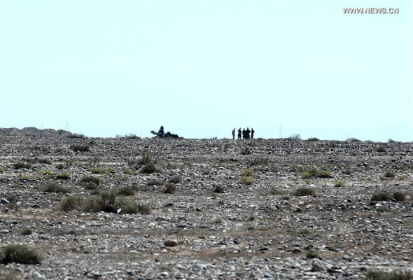 Photo taken on Aug. 27, 2016 shows the accident site after an acrobatic plane plummeted to the ground during the 1st Silk Road International General Aviation Convention in Zhangye, northwest China's Gansu Province. The pilot of the acrobatic plane was killed. (Xinhua/Fan Peishen)