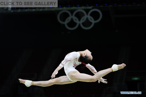 Chinese gymnast Fan Yilin acts during a training session at the Rio Olympic Arena in Rio de Janeiro, Brazil, on Aug. 4, 2016. Olympic gymnastics competitions are scheduled to start on Aug. 6. (Xinhua/Zheng Huansong)