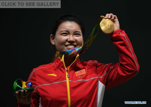 Zhang Mengxue of China shows the gold medal at the awarding ceremony of the Women's 10m Air Pistol of the 2016 Rio Olympic Games at the Olympic Shooting Centre in Rio de Janeiro, Brazil, on Aug. 7, 2016. (Photo/Xinhua)