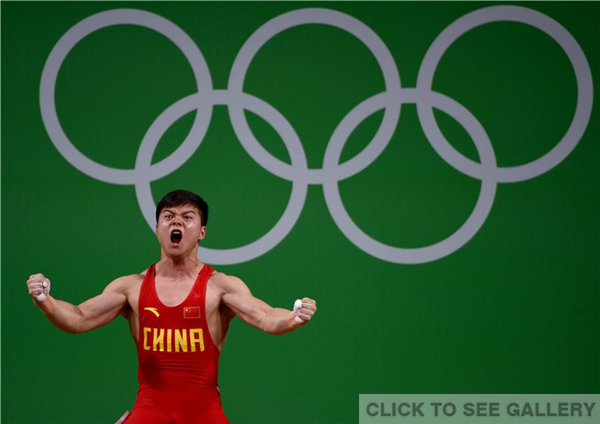 Long Qingquan of China wins the men's 56kg category of the Rio 2016 Olympic Games weightlifting events at the Riocentro in Rio de Janeiro, Brazil, August 7, 2016. (Photo/China Daily)