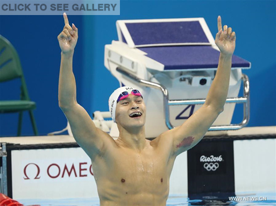 Sun Yang of China celebrates after the men's 200m freestyle swimming final at the 2016 Rio Olympic Games in Rio de Janeiro, Brazil, on Aug. 8, 2016. Sun Yang won the gold medal with 1 minute 44.65 seconds. (Photo/Xinhua)