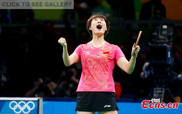 Ding Ning reacts after beating fellow Chinese player Li Xiaoxia during the women's singles gold medal match of table tennis at the Rio Olympics in Rio de Janeiro, Brazil, Aug. 10, 2016. (Photo: China News Service/Du Yang)