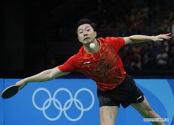 China's Zhang Jike returns the ball against Vladimir Samsonov of Belarus during men's singles semifinal of table tennis at the 2016 Rio Olympic Games in Rio de Janeiro, Brazil, on Aug. 11, 2016. Zhang Jike won 4-1. (Photo/Xinhua)