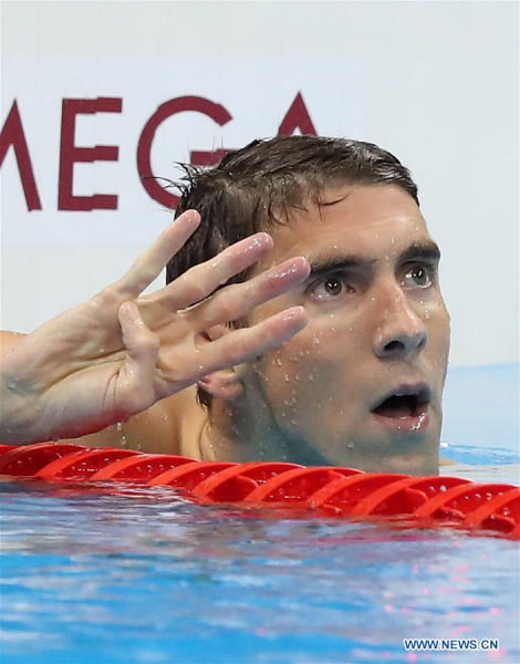 Michael Phelps of the United States celebrates after the men's 200m individual medley final at the 2016 Rio Olympic Games in Rio de Janeiro, Brazil, on Aug. 11, 2016. Michael Phelps won the gold medal. (Xinhua/Cao Can)