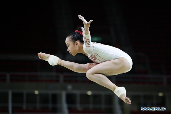 Chinese gymnast Fan Yilin acts during a training session at the Rio Olympic Arena in Rio de Janeiro, Brazil, on Aug. 4, 2016. Olympic gymnastics competitions are scheduled to start on Aug. 6. (Xinhua/Zheng Huansong)