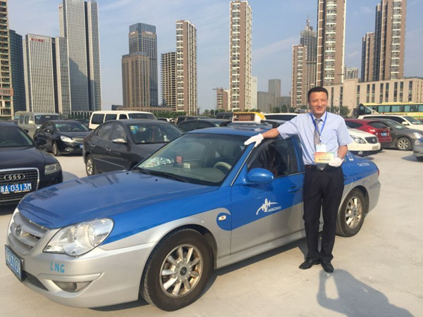 Driver Wang Jun with his special taxi for the G20 summit. Photo: Jiang Jie