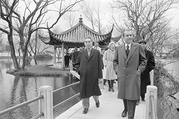 Richard Nixon (right), former US president, along with Zhou Enlai, former Chinese premier, strolls through Huagang Park on West Lake in Hangzhou on Feb 26, 1972. The Shanghai Communique was actually agreed upon in Hangzhou. (Photo from Corbis by Bettmann)