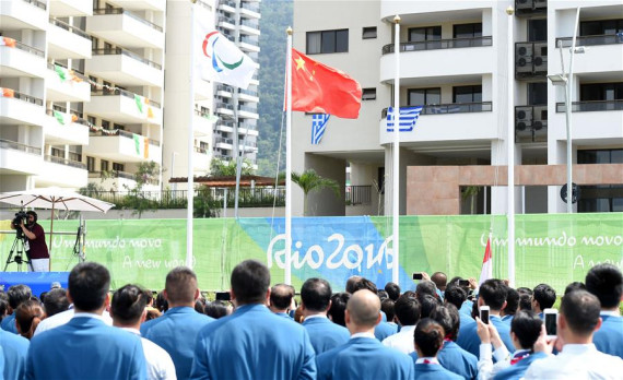 Members of the Chinese delegation participate in the flag-raising ceremony at the Paralympic Village in Rio de Janeiro, Brazil, on Sept. 5, 2016. (Photo: Xinhua/Li Gang)