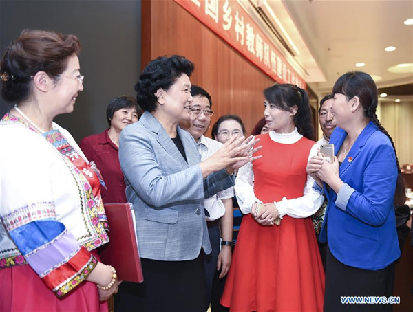 Chinese Vice Premier Liu Yandong talks to teachers working in rural areas after a promotion meeting in Beijing, capital of China, Sept. 7, 2016. Liu has called for more efforts to support rural teachers and improve the rural education, before national Teachers' Day on Sept. 10. (Xinhua/Zhang Ling)