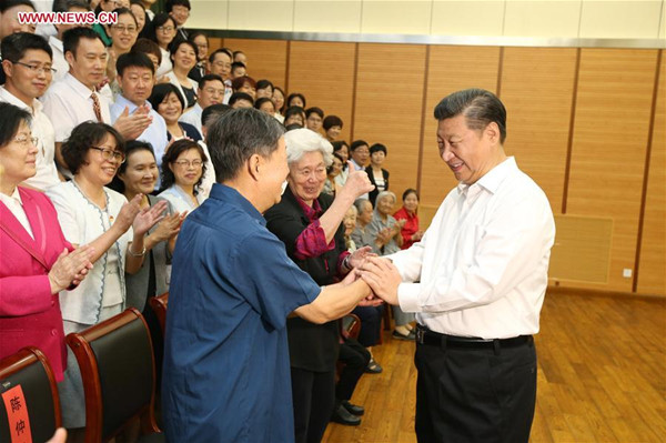 Chinese President Xi Jinping (1st R) shakes hands with representatives of teachers and students during an inspection visit to Beijing Bayi School before the upcoming national Teacher's Day in Beijing, Sept. 9, 2016. (Xinhua/Yao Dawei)