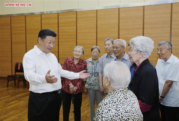 Chinese President Xi Jinping (1st L) talks to elder teachers during an inspection visit to Beijing Bayi School before the upcoming national Teacher's Day in Beijing, Sept. 9, 2016. (Xinhua/Ju Peng)