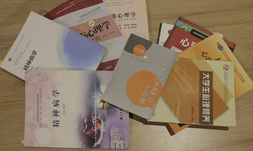 College textbooks that Qiu Bai says discriminate against gay people. (Photo/Courtesy of Qiu Bai)