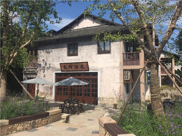 Tourists visit Wucun for its pastoral appeal. The village in the famous water town Wuzhen in Zhejiang province has been developed into a tourist attraction that brings city people close to nature, and they can enjoy fresh food directly from the fields. Photo by Yang Feiyue / China Daily