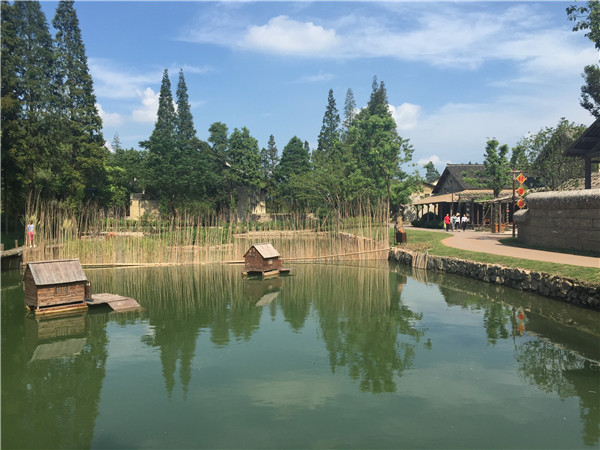 Tourists visit Wucun for its pastoral appeal. The village in the famous water town Wuzhen in Zhejiang province has been developed into a tourist attraction that brings city people close to nature, and they can enjoy fresh food directly from the fields. Photo by Yang Feiyue / China Daily