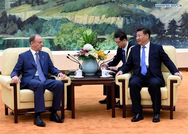 Chinese President Xi Jinping (R) meets with Nikolai Patrushev, secretary of the Russian Security Council, in Beijing, capital of China, Sept. 14, 2016. (Xinhua/Rao Aimin)